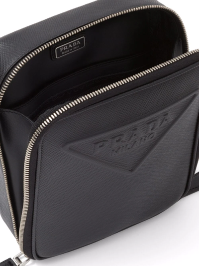 Shop Prada Logo-embossed Saffiano Leather Bag In Schwarz