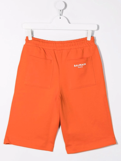 Shop Balmain Teen Logo Print Track Shorts In Orange