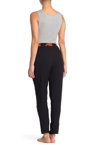 Shop Aqs Soft Knit Lounge Pants In Black W/ Orange