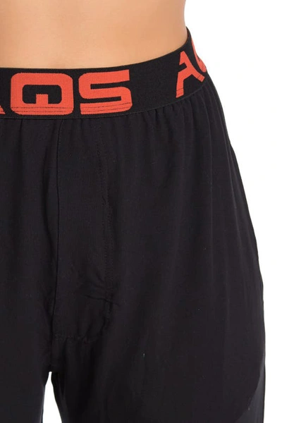 Shop Aqs Soft Knit Lounge Pants In Black W/ Orange