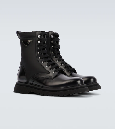 Prada Logo-plaque Panelled Ankle Boots In Black