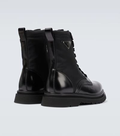Prada Logo-plaque Panelled Ankle Boots In Black