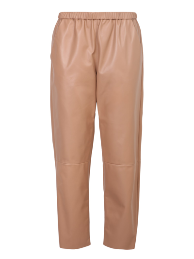 Shop Drome Tapered Trousers In Beige