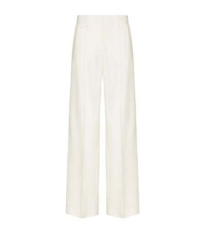 Shop Valentino Wool Wide-leg Trousers In Ivory