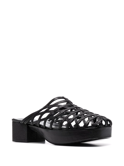 Shop By Far Caged Leather Mules In Schwarz