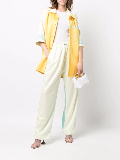 Shop Khrisjoy Contrasting Panel-detail Trousers In Gelb