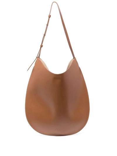 Shop Aesther Ekme Flat Hobo Leather Shoulder Bag In Brown