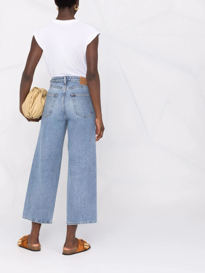 Shop Totême High-waisted Wide-leg Jeans In Blau