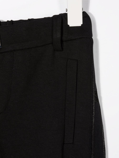 Shop Givenchy Side Stripe Detail Trousers In Black