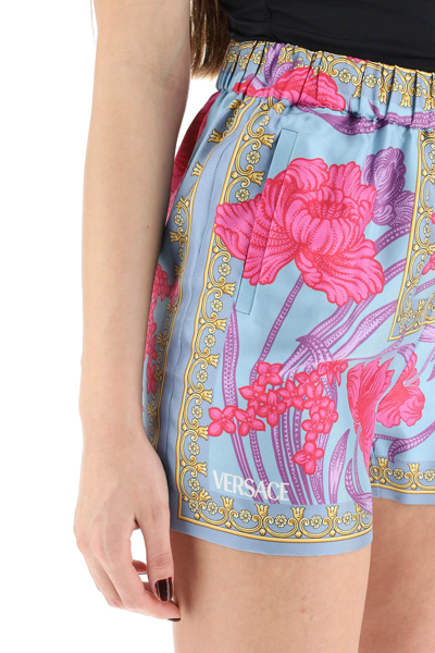 Shop Versace Silk Shorts With Acid Bouquet Print In Light Blue,fuchsia,gold