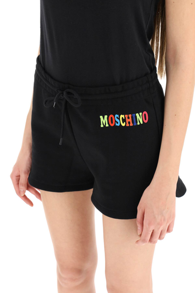 Shop Moschino Sweatshorts With Multicolor Logo In Black