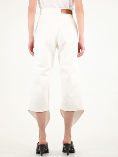 Shop Loewe Cropped Curved Jeans In Ivory