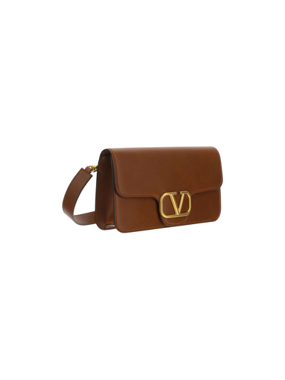 Shop Valentino Garavani Messenger Bag In Tan