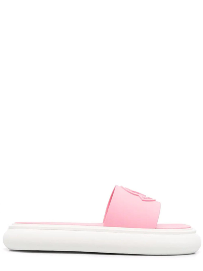 Shop Moncler Debossed Logo Pink Slyder Flat Sandals