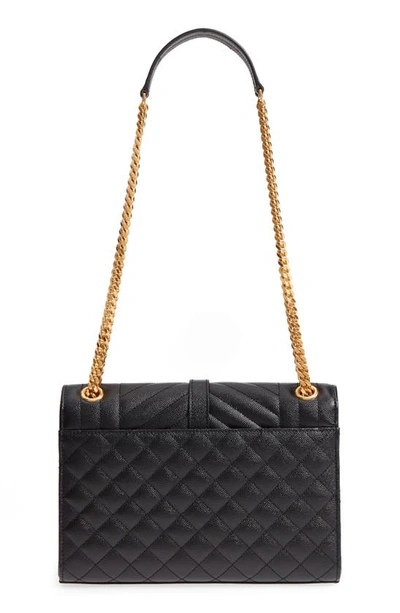 Shop Saint Laurent Medium Cassandra Calfskin Shoulder Bag In Noir