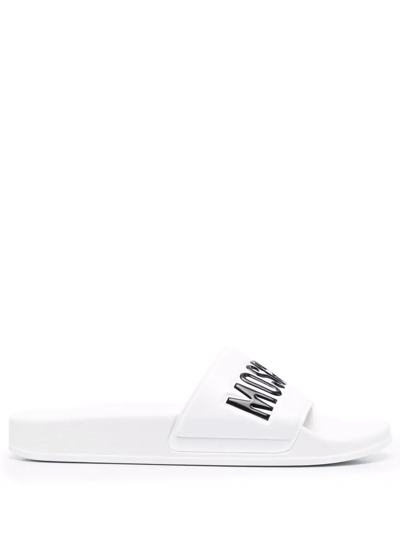 Shop Moschino Embossed Logo Slides In Weiss