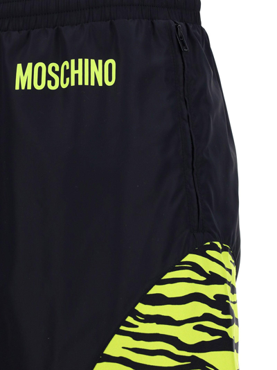Shop Moschino Logo Print Jogging Pants In Fantasianero
