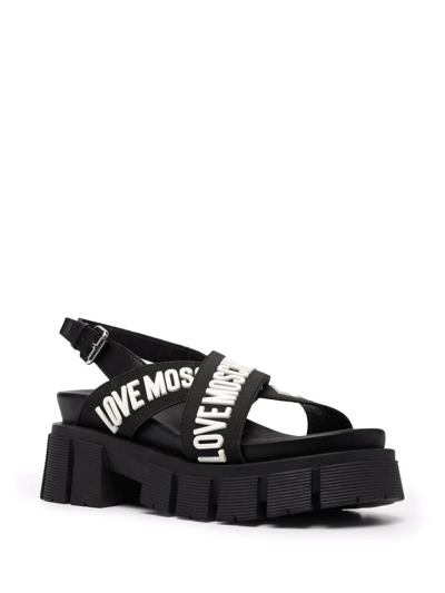 Shop Love Moschino Crossover Logo Strap Sandals In Black