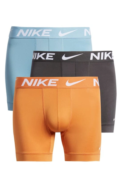 Shop Nike 3-pack Dri-fit Essential Micro Boxer Briefs In Worn Blue/curry/smoke Grey