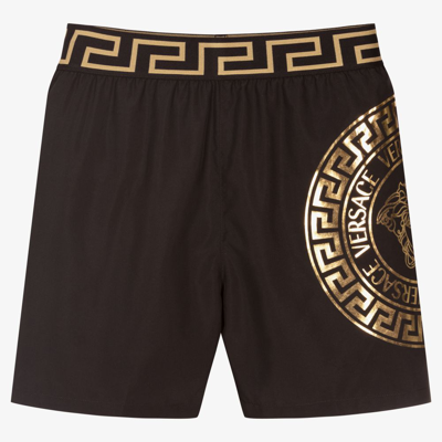 Shop Versace Teen Boys Medusa Swim Shorts In Black