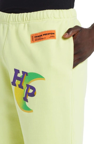 Shop Heron Preston Global Collage Organic Cotton Sweatshorts In Lemon Yellow