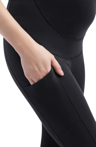 Shop Kimi And Kai Flo Belly & Back Support Pocket Maternity Capri Tights In Black