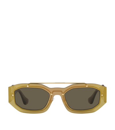 Shop Versace Irregular Medusa Sunglasses In Brown