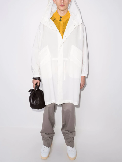 Shop Jil Sander Logo-print Hooded Raincoat In Weiss