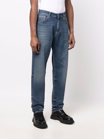 Shop Represent Faded-effect Jeans In Blau