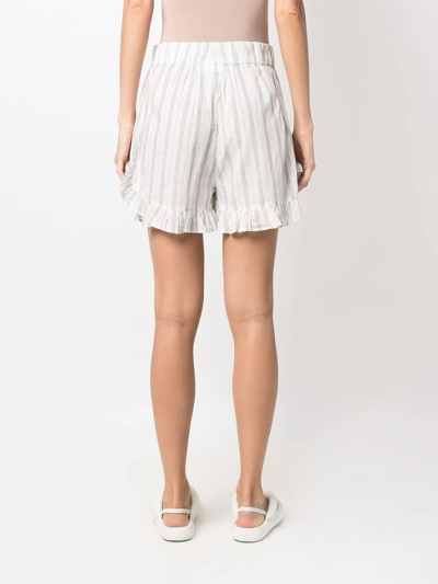 Shop Ganni Ruffle-trim Striped Shorts In Weiss