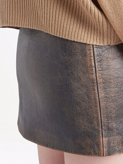 Shop Prada Faded-effect Leather Miniskirt In Schwarz