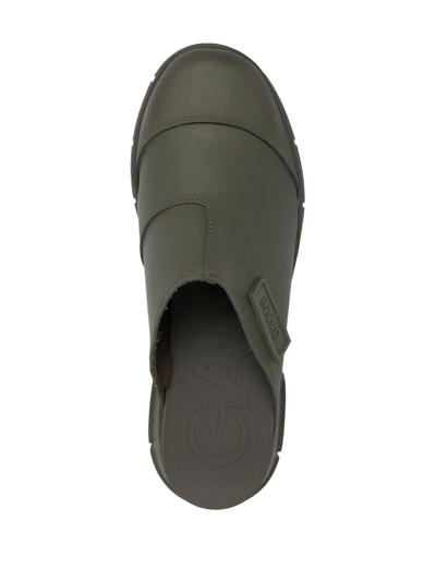 Shop Ganni City Recycled-rubber Mules In Grün