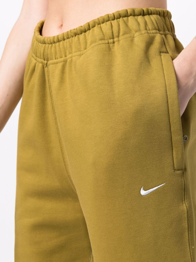 Shop Nike Solo Signature-smoosh Track Pants In Grün