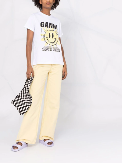 Shop Ganni Magny Wide-leg Jeans In Gelb
