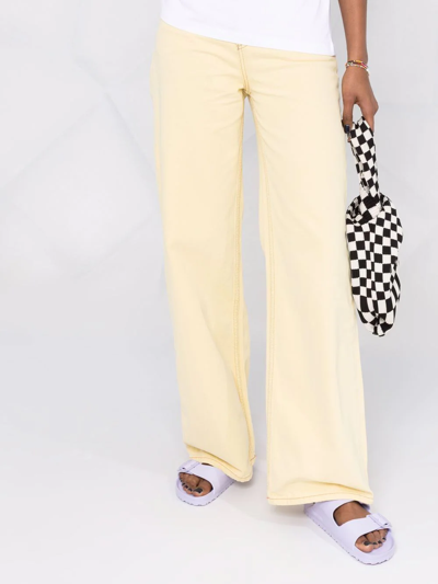 Shop Ganni Magny Wide-leg Jeans In Gelb