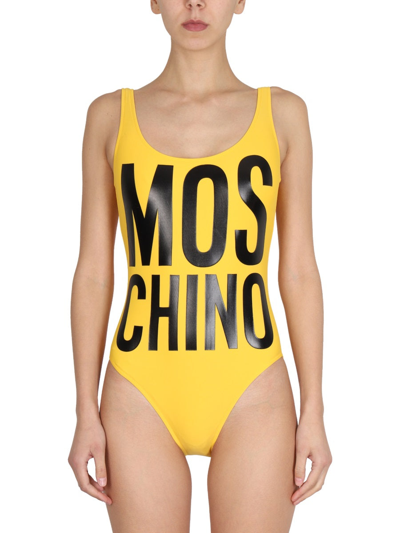 Shop Moschino Maxi Logo Swimsuit In Yellow