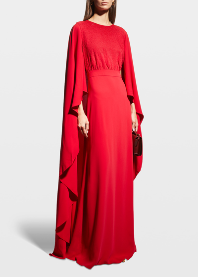 Shop Carolina Herrera Cascading Cape Gown In Lacquer Red