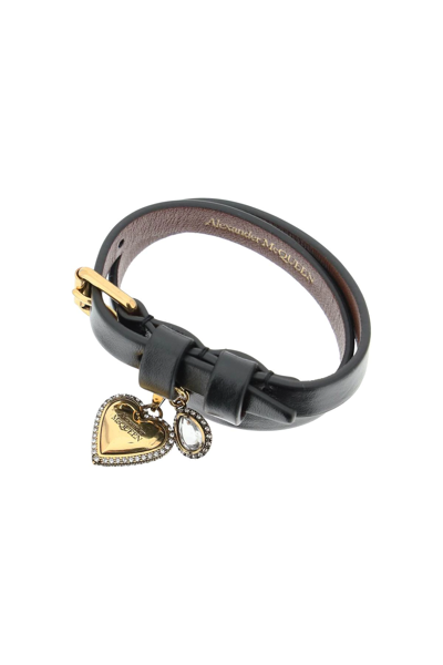 Shop Alexander Mcqueen Leather Bracelet With Heart Charm In Black