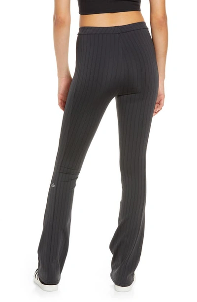 Shop Alo Yoga Alo Zip It Pinstripe High Waist Zip Cuff Flare Leggings In Anthracite/ Black