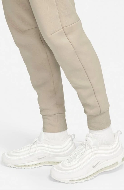 Shop Nike Tech Fleece Jogger Sweatpants In Cream/ Court Blue/ Black