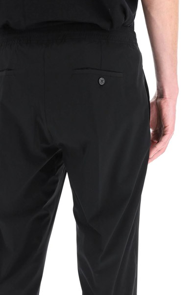 Shop Neil Barrett Travel Slim Trousers In Black