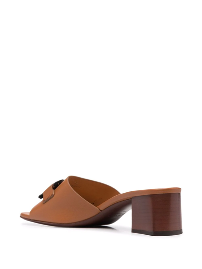 Shop Tod's Leather Chain-appliqué Mules In Brown