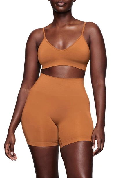 Shop Skims Soft Smoothing Seamless Shorts In Copper