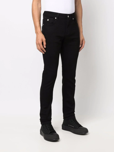 Shop John Richmond Logo-print Slim-cut Trousers In Schwarz