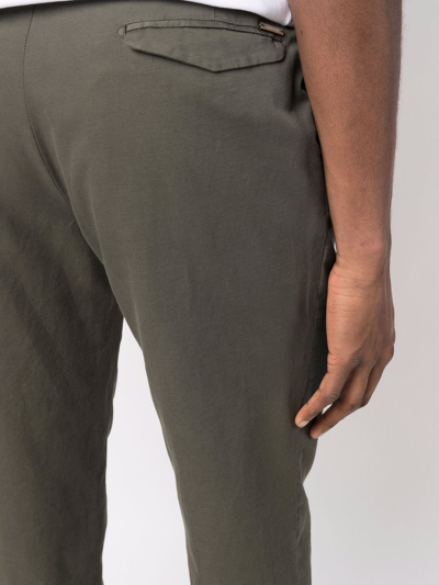 Shop Corneliani Pleat-detail Chino Trousers In Grün