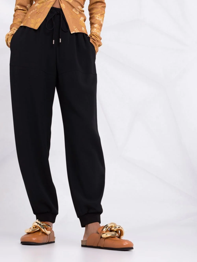 Shop Chloé Drawstring-waist Cuffed Trousers In Black