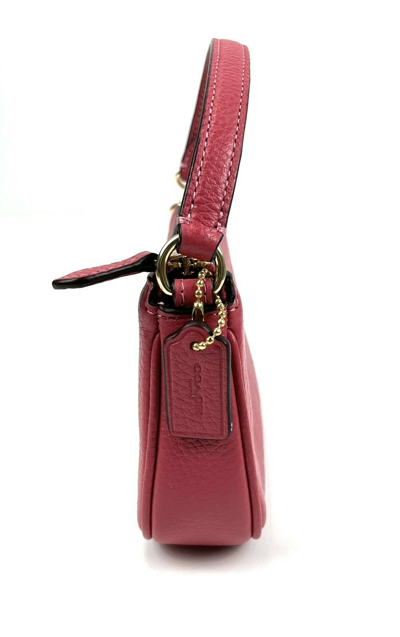 COACH Nolita Wristlet 15 In Pebble Leather in Pink