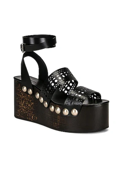 Alaïa 85mm Wooden-heel Wedge Sandals With Vienne Leather Straps And Studs In Noir