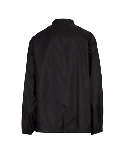 Shop Balenciaga Allover Logo Printed Rain Jacket In Black