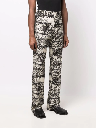 Shop Amiri Graphic-print Flared Trousers In Nude